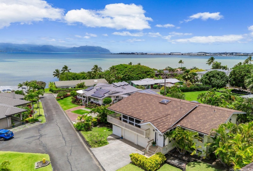 Gorgeous custom home in the Ko'olau Vista subdivision provides deeded ocean access to all 8 homes on this private lane. The underground electricity and deeded view corridors ensure that this home maintains an unobstructed panoramic view of Kaneohe Bay and the Ko'olau Mountains.  This home is situated to have one of the best views on the lane.