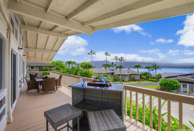 Large 398 sf lanai has plenty of space for a conversation set, dining and a bar area.  The living room and primary suite have sliding doors to the lanai.  The panoramic Kaneohe Bay and Ko'olau mountain views from the lanai are spectacular.