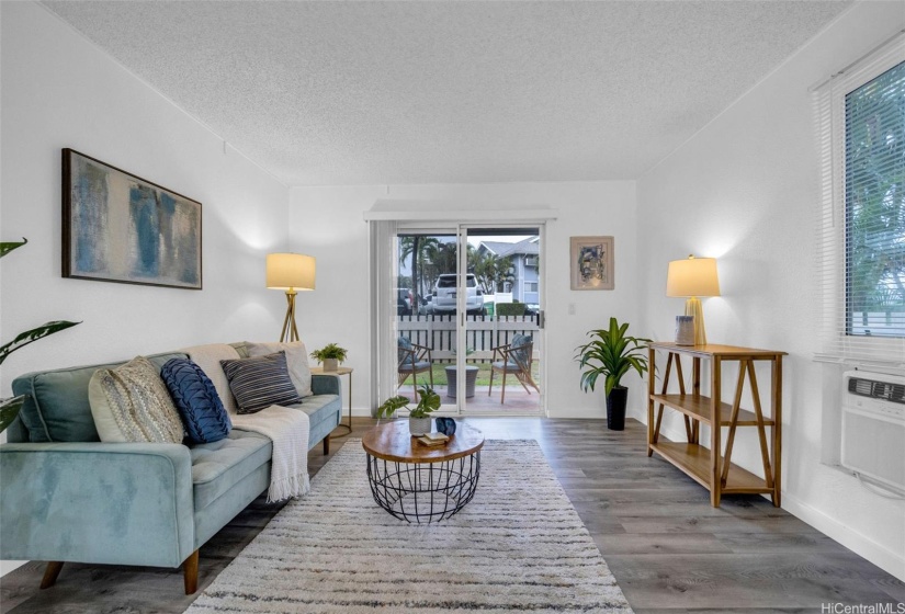 Another living room view with wall air conditioner.