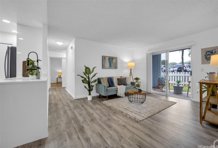 Living room opens to the lanai. New luxury vinyl flooring.