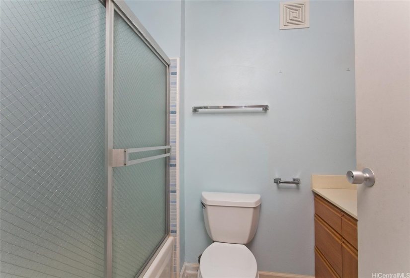 Hall bathroom with tub.