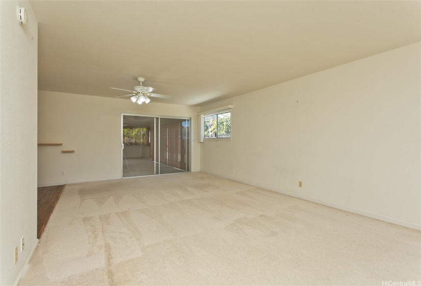 Foreground is sliding door to enclosed lanai.