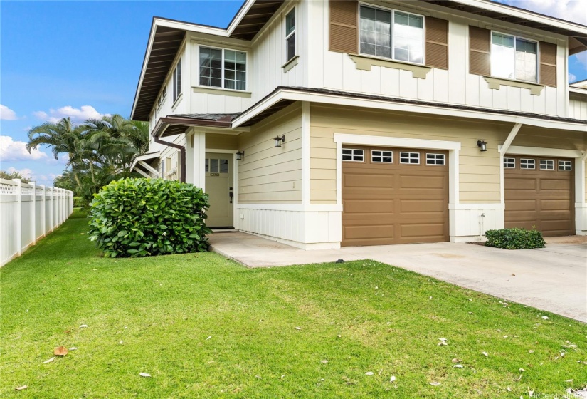 Corner/end unit has one covered garage + one tandem parking space