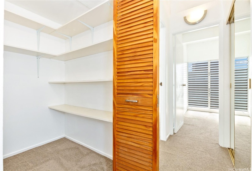 Lots of extra storage in the closet just outside the bathroom.  The bedrooms are a few steps down the hall.