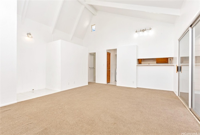 Looking across the living room.  The entry door is on the left & kitchen pass through in the right.  Where will you put your dining table?