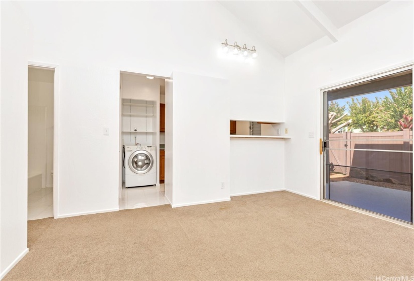 Back in the living room that’s the bathroom on the left & the kitchen kitchen is to the right or the washing machine.