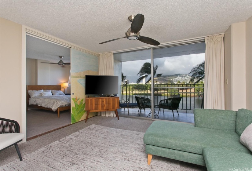 This large bright  living area has lovely views of the Ala Wai, sunrises, mountains.