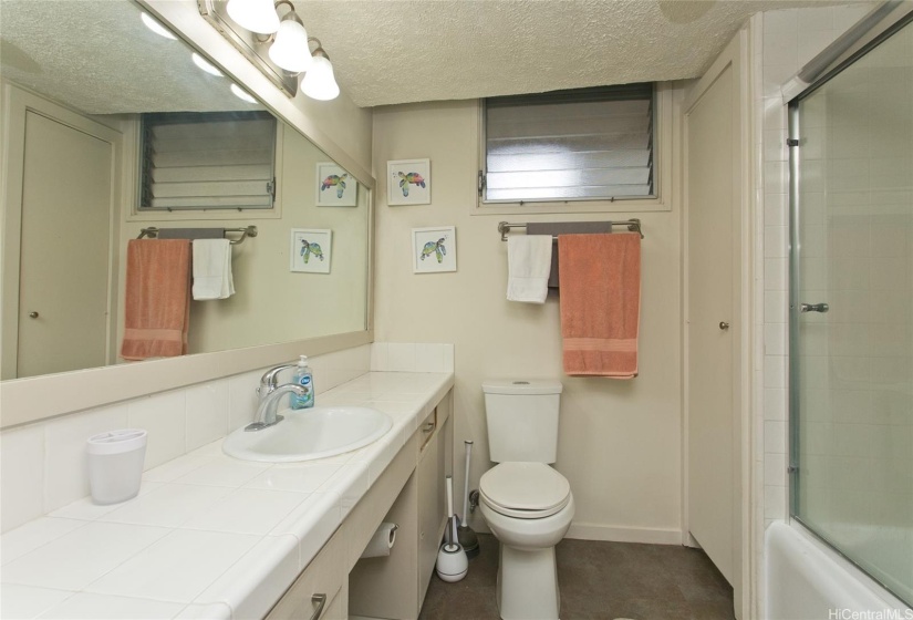 Spotless clean bathroom provides plenty of space to move around.