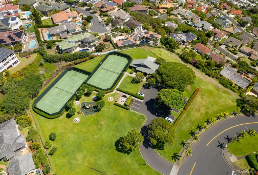 Playground and park for exercise. Full-sized tennis courts in one of two parks in gated community.