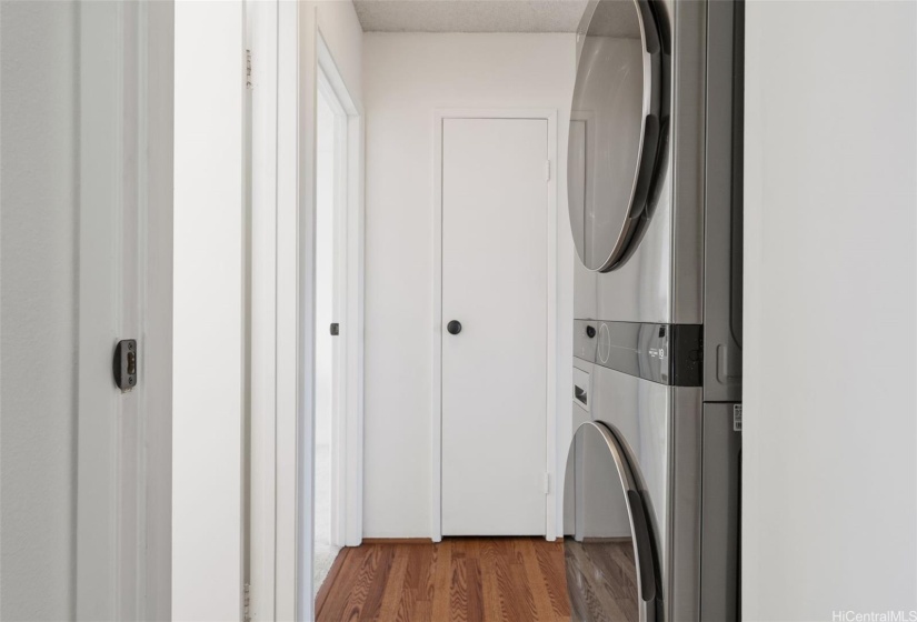 Hallway with front load washer and dryer