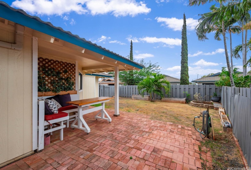 Built in outdoor furniture ready to go. One of the largest lots in lower Kapolei! A bit of water and TLC will surely bring it back to life. Imagine backyard BBQs here!