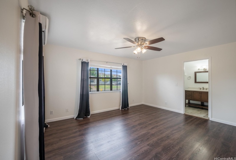 Primary bedroom with Split AC and full bath.