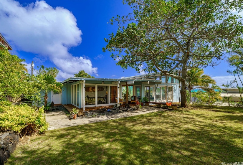 The yard is a wonderful flat space - perhaps a pool or tropical garden area.  Imagine your possibilties?