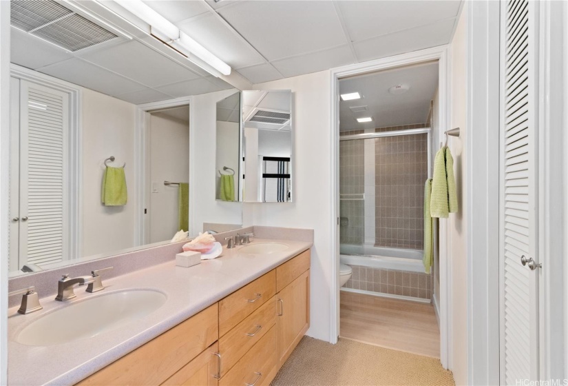 PRIMARY BATHROOM WITH DOUBLE SINKS AND WALK-IN CLOSET.