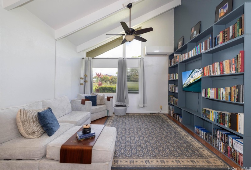 Vaulted living room ceiling with custom bookshelf