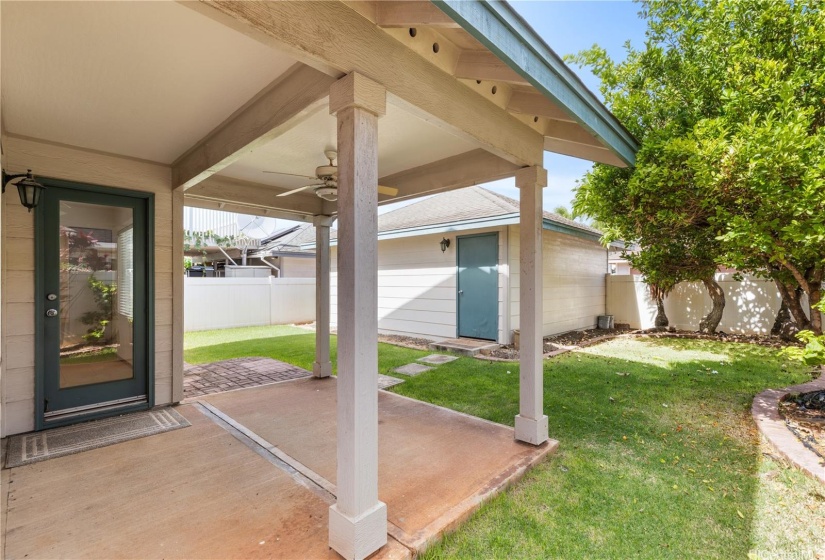 Backyard lanai with lots of grass space