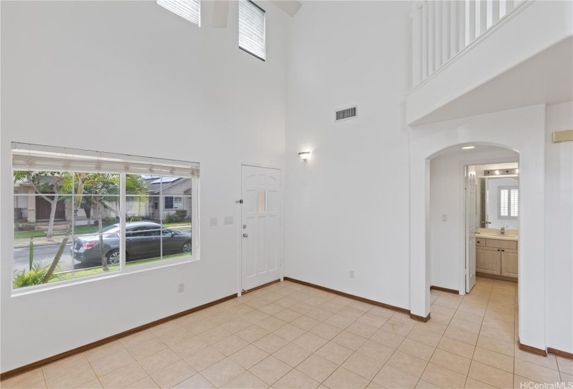 Living area space with 1st floor full bedroom, bathroom, and laundry room