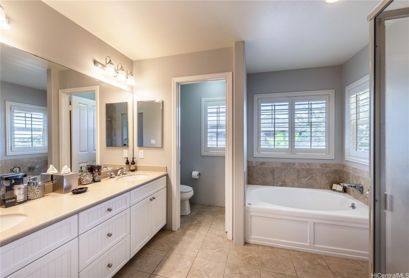 Primary Bathroom has Soaking Tub and a Water Closet.