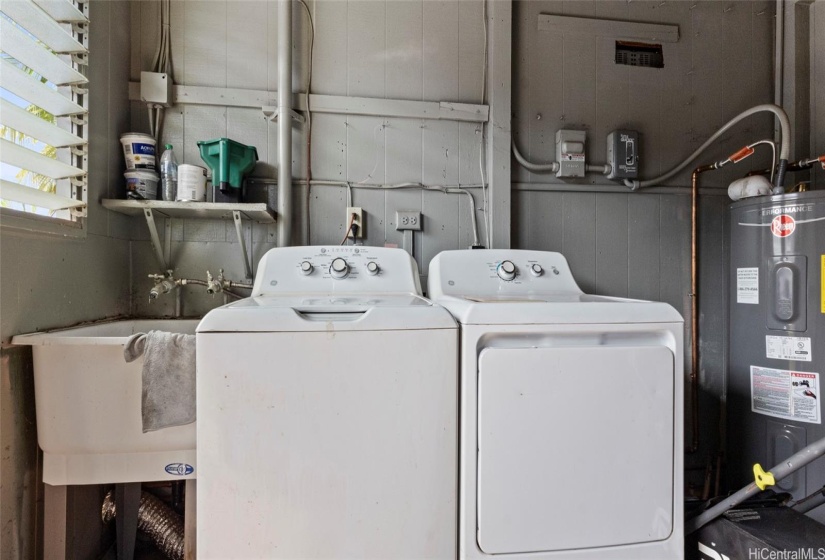 Laundry room located just outside kitchen entry door.