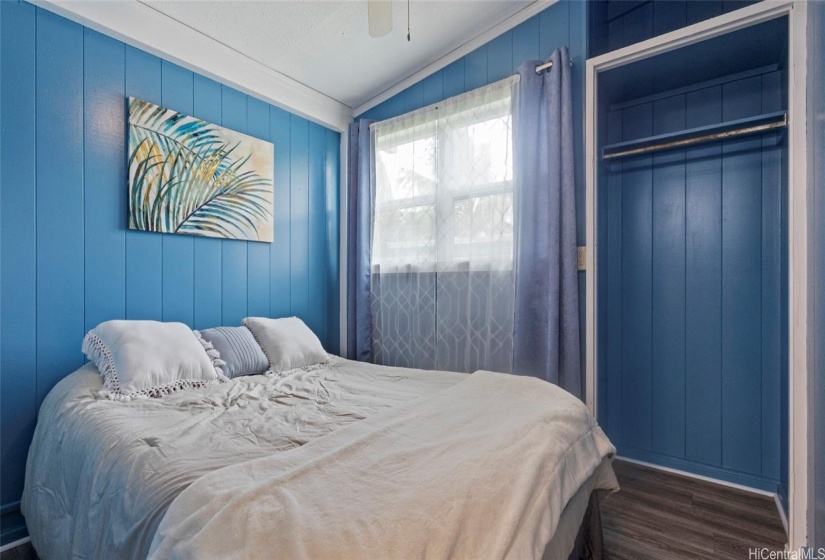 Bedroom #1- A cool blue with newer vinyl woods.