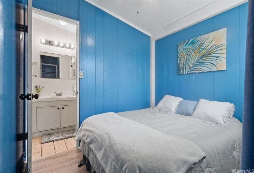 Bedroom #1- A cool blue with newer vinyl woods.