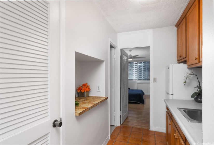 Pantry and kitchen alcove provides ample space for your kitchenware.