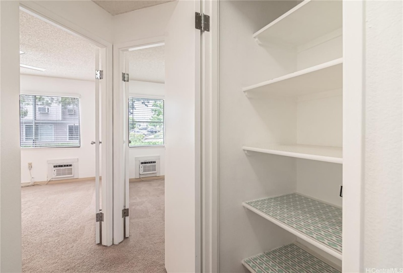 Hallway leading to 2 bedrooms.