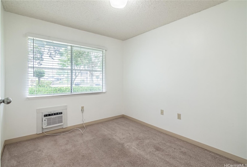 2nd bedroom with newer window ac unit.