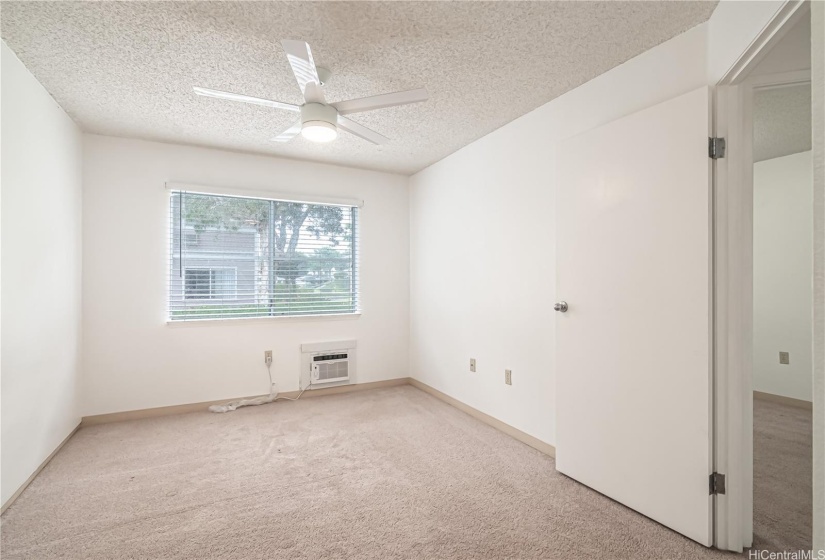 Master Bedroom. Newer window ac unit.