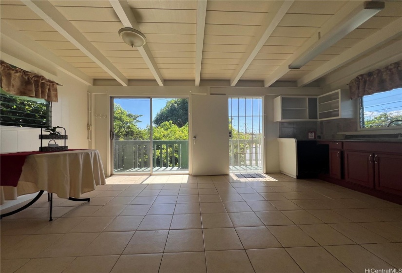 Upstairs living space with wetbar and balcony entry