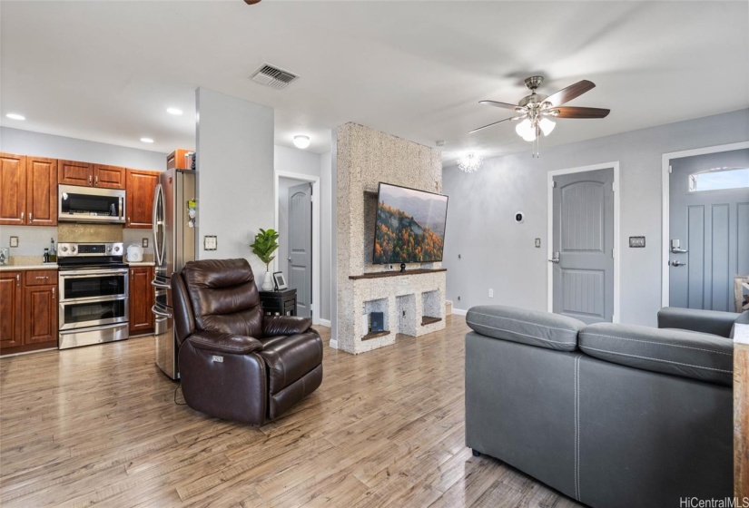 Kitchen and living room views. Looking towards the front door and garage door entrances.