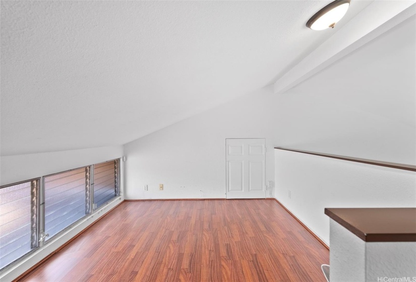 Cool loft adds additional space for a home office or lounging area