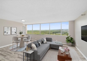 Large Living Area with Gorgeous Views. Enhanced: Photo is virtually staged.
