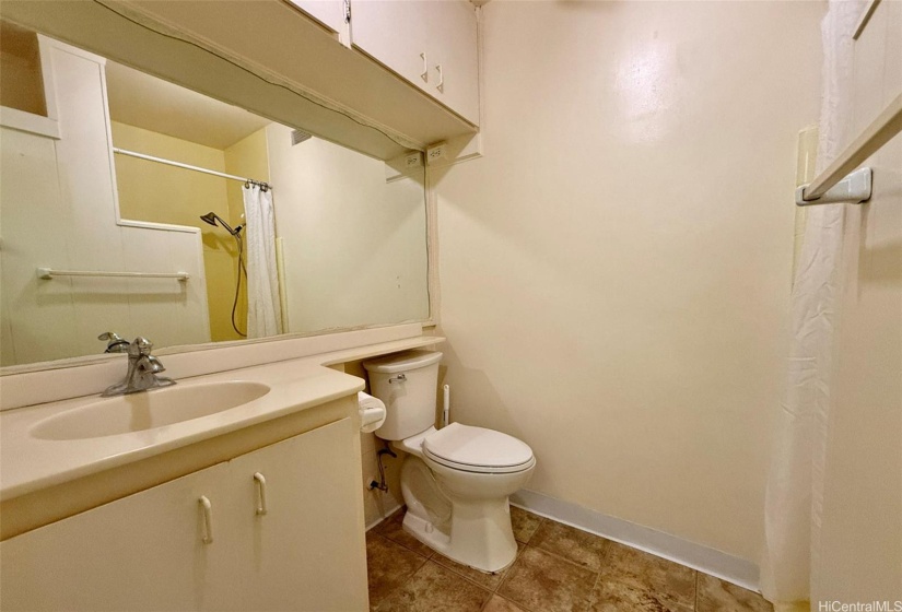 Good sized full bathroom. You can see the shower stall in the mirror.