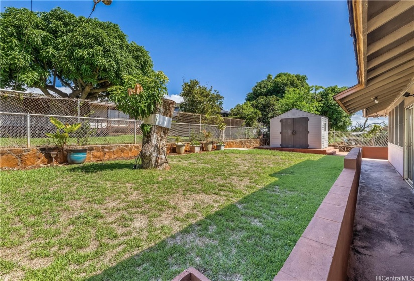 Spacious flat back yard area is perfect for gardening, pets and kids. There is also a walk in storage shed to hold all of your tools and toys.