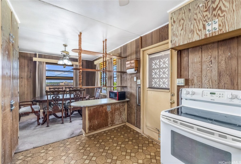 Dining area is next to the kitchen. There is a door leading out to side of the house and laundry room and 2nd bathroom.