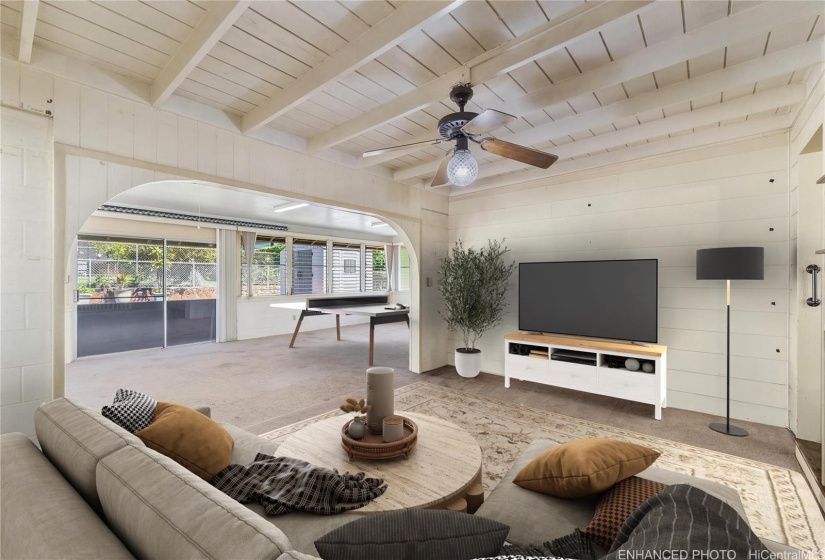 View looking towards the added family room. Enhanced/ virtually staged.