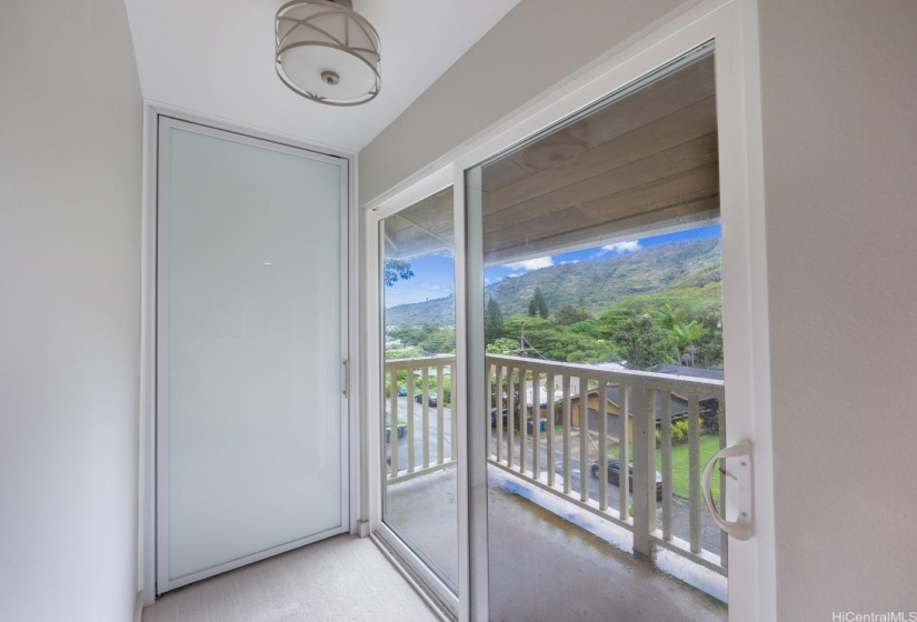 Shoe closet and private lanai with valley views.