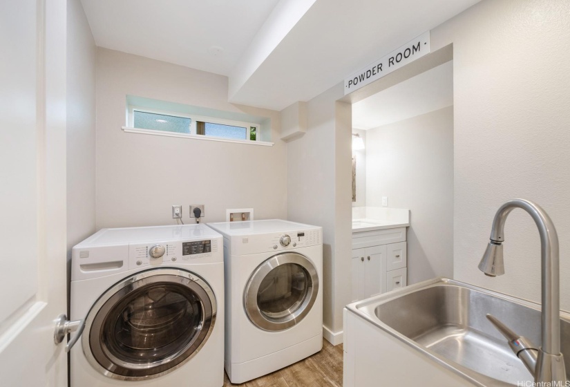 Laundry room and combined powder room in the hall off of the kitchen.