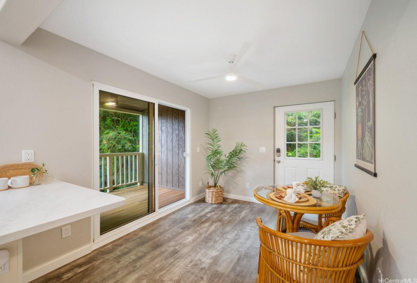 Dining, lanai, and door to the back of the home.