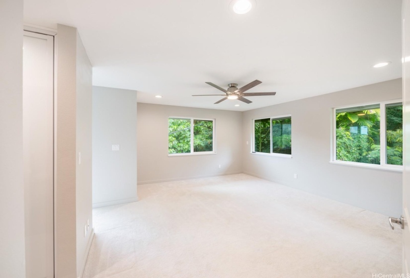 HUGE primary room with walk in closet, bathroom, bonus shoe closet and private lanai.