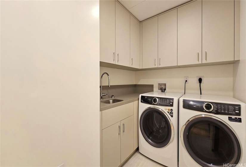 Dedicated Laundry Room with side by side laundry