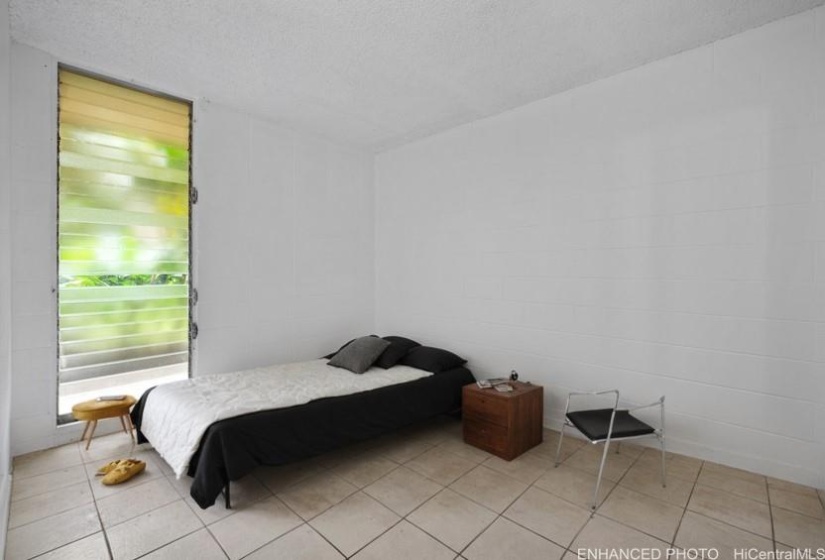 Enhanced photo with virtual staging of bedroom 2.
