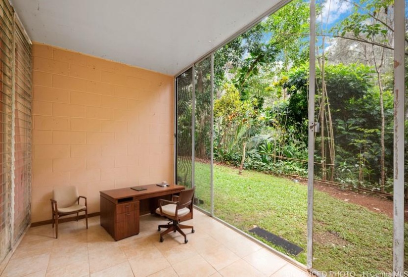 Enhanced photo with virtual staging for the indoor patio.