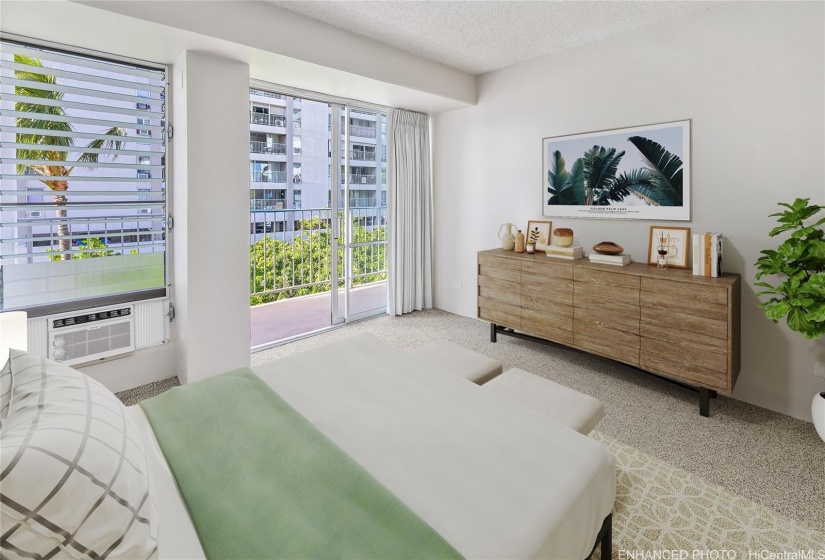 Primary Bedroom with floor to ceiling sliding windows and wall mount AC.Enhanced photo. Virtual staging.