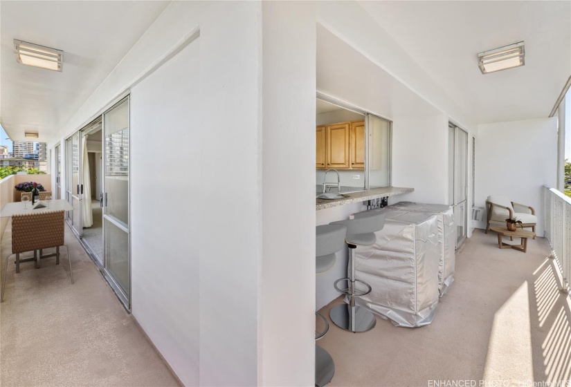 Wrap around lanai with pass through from kitchen. Enhanced photo. Virtual staging.