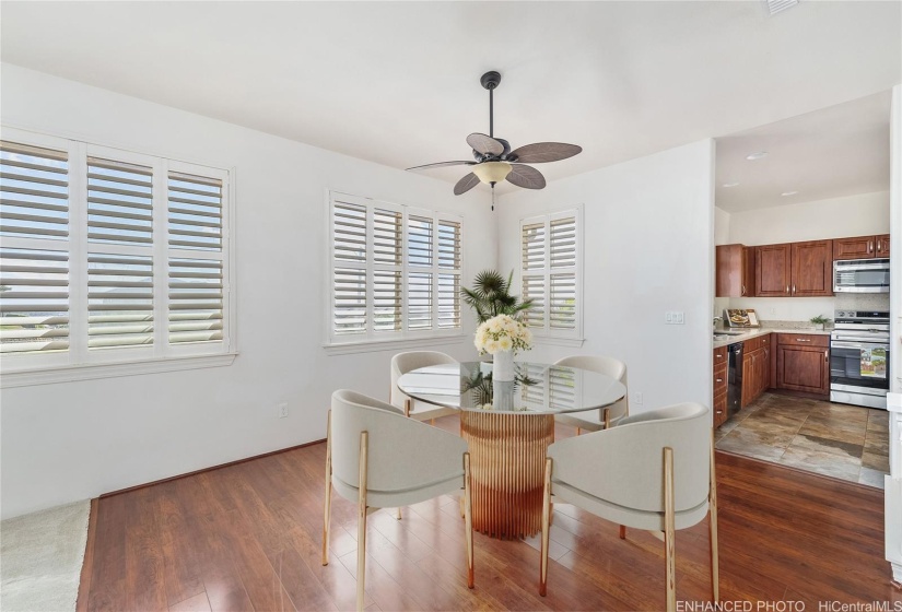 Formal dining area with kitchen view. Virtually staged. Enhanced photo.