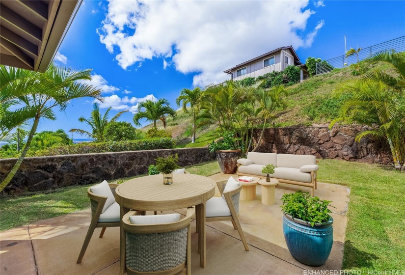 Back Yard. Lanai with ocean views. Virtually staged. Enhanced photo.