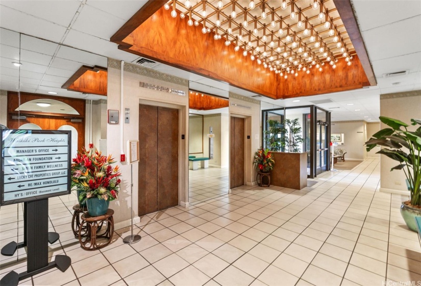 Lobby entrance with 2 elevators to your unit, the pool and the community laundry area.