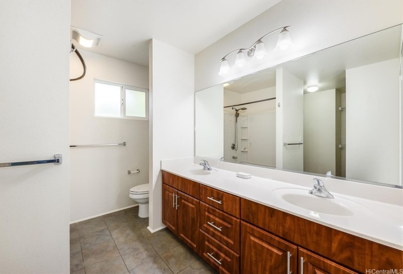 Primary bath with dual vanity.